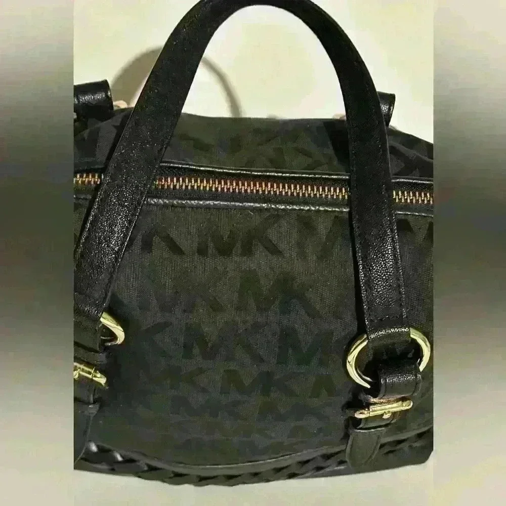 A Mickael Kors black Gladstone satchel with gold tone hardware.